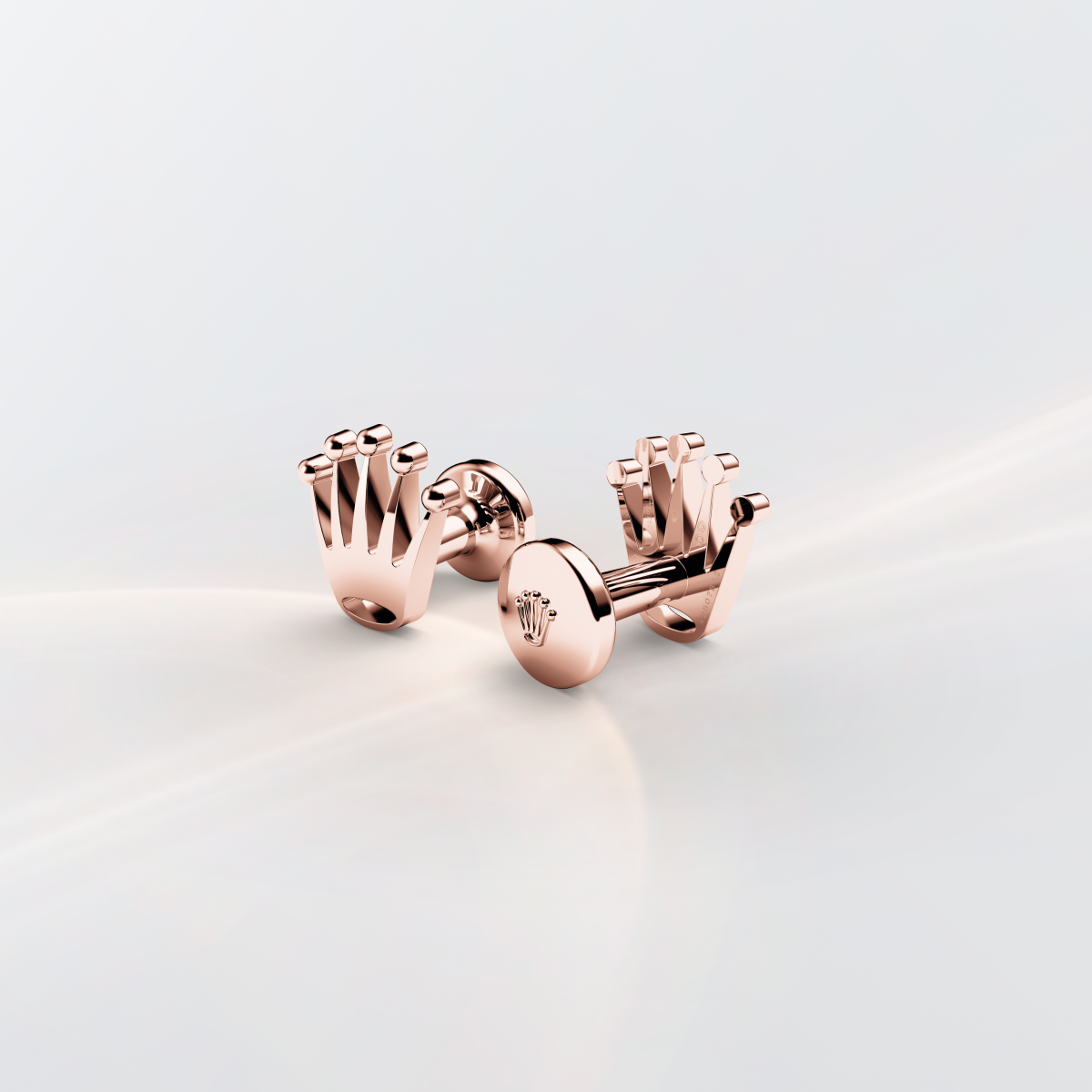 Rolex cufflinks made of 18 ct Everose gold and shaped in the form of the signature Rolex crown.