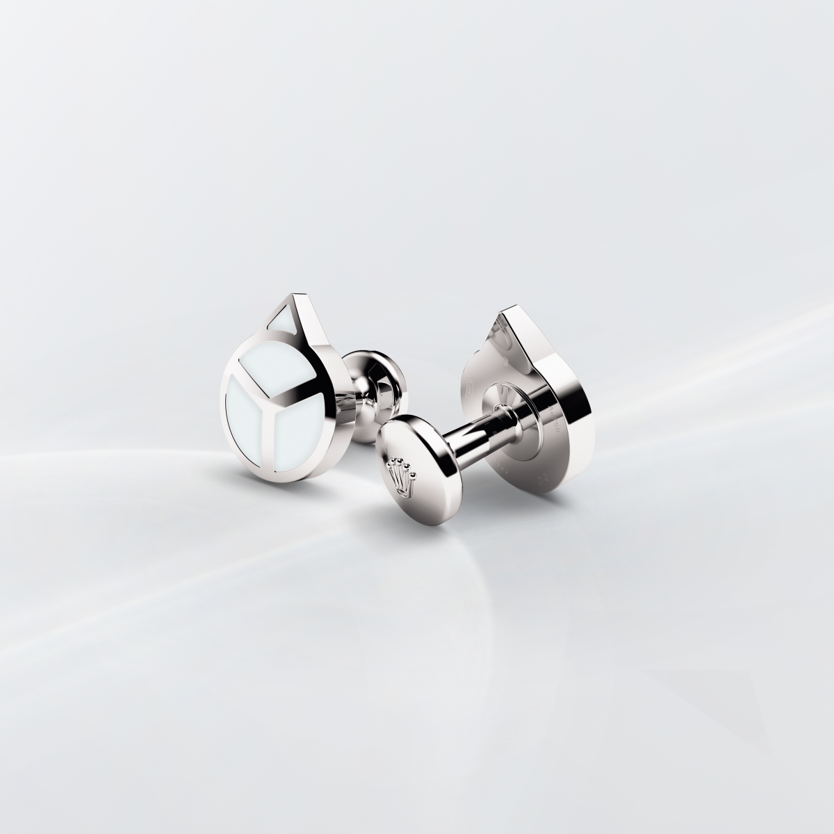 Rolex cufflinks made of 18 ct white gold that echo the hour hand found on Professional Rolex watches, equipped with a Chromalight display.