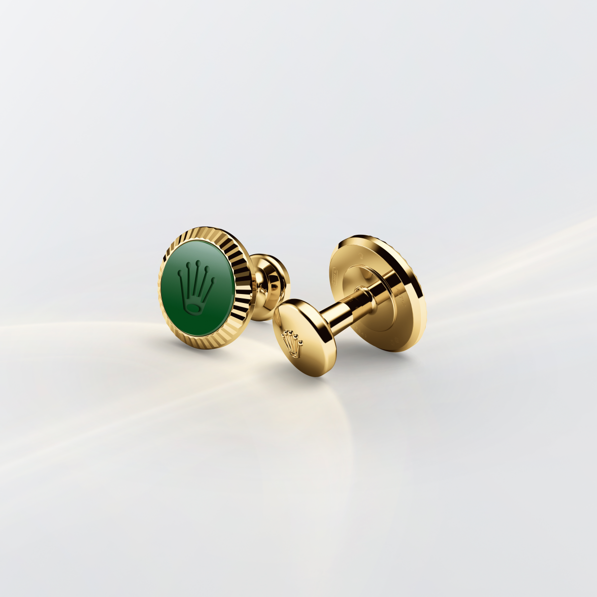 Rolex cufflinks made of 18 ct yellow gold featuring the signature Rolex fluting, Cerachrom insert and Rolex crown.